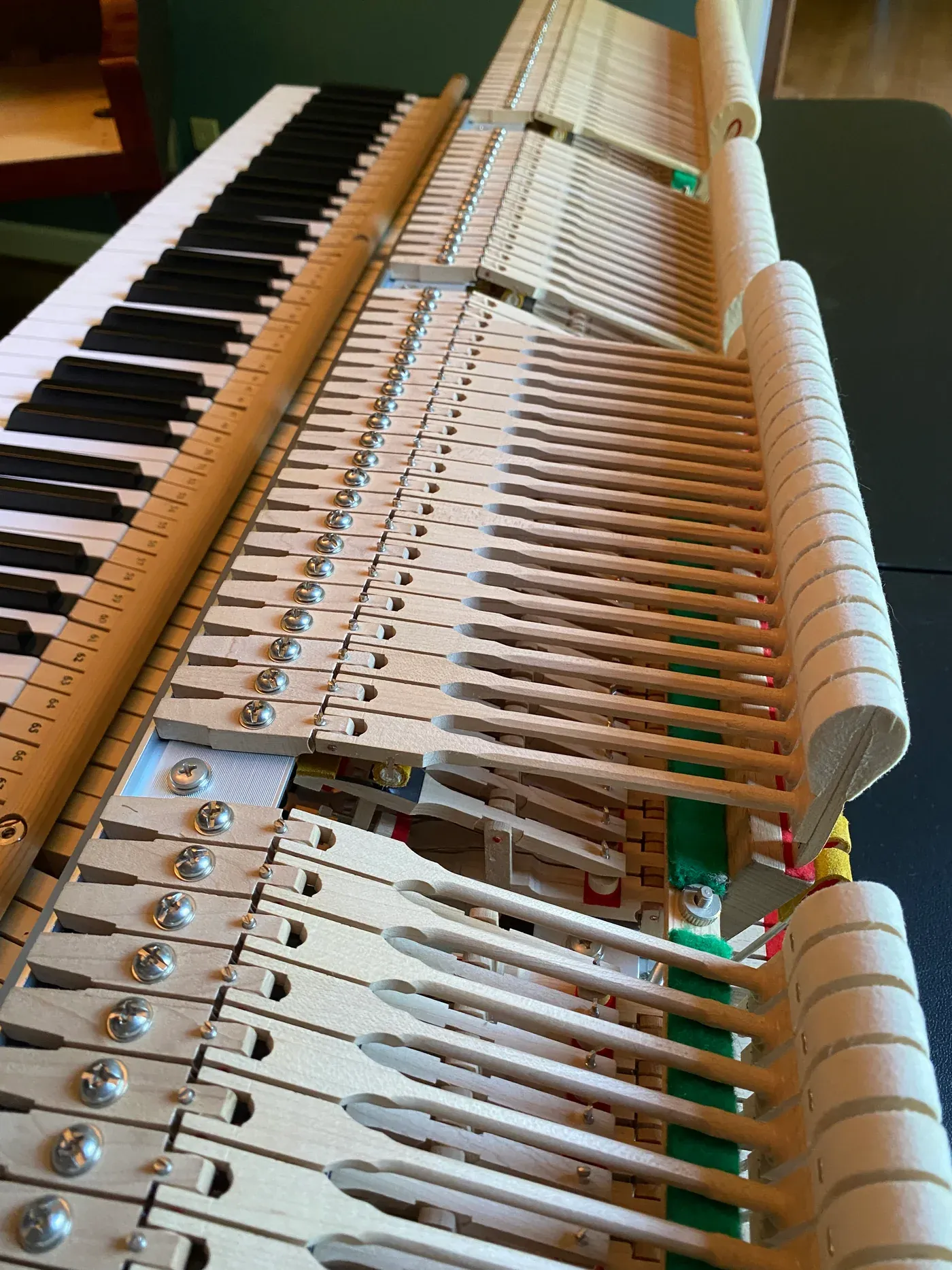 The exposed action and hammers of an upright piano